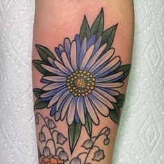 a blue and white flower on the leg