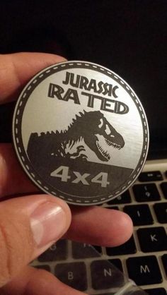 someone is holding up a sticker that says, jurasic irated 4x4