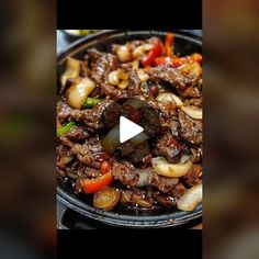 an image of beef and vegetables in a skillet with a video playing on the screen