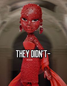 a red doll with words that say they didn't