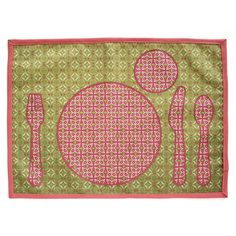 a place mat with pink and green designs on it