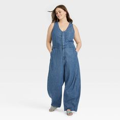 Embrace casual chic with this Curved-Leg Denim Jumpsuit from Universal Thread™. The blue denim medium-wash jumpsuit is made of a midweight cotton-lyocell blend for comfortable all-day wear. The sleeveless design is given a sophisticated twist with the front snap placket over a half-length zipper fastening, while the flattering V-neckline and curved-leg silhouette offer a breezy look. Multiple front and back pockets complete the design with functional flair. Universal Thread™: Found exclusively a Short Sleeve Denim Jumpsuit, Denim Jumpsuit Outfit, Womens Denim Jumpsuit, Womens Denim Overalls, Baggy Jumpsuit, Maxi Jumpsuit, Jumpsuit Outfit, Short Sleeve Jumpsuits, Mommy Life