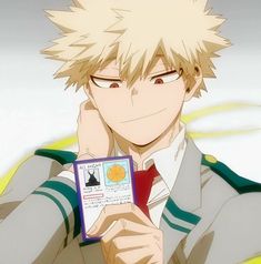 an anime character with blonde hair holding up a card