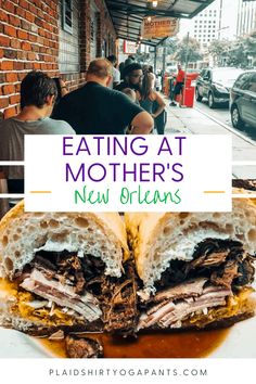 a sandwich cut in half with the words eating at mother's new orleans