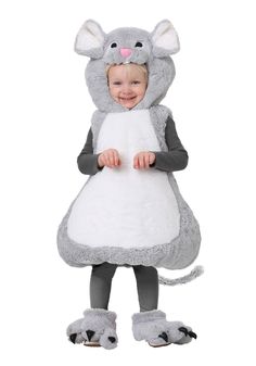 a child in a mouse costume standing with her hands on her hips and smiling at the camera