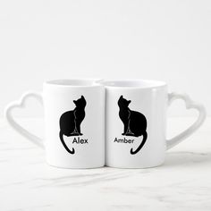 two white mugs with black cats and the words alex and amber written on them