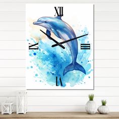 a clock with a dolphin on the face and watercolor paint splatters around it