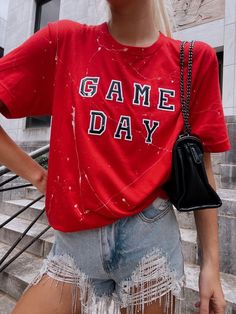 red and black gameday tee with rhinestone shorts <3 perfect for uga gameday #gamedayoutfit #gamedayootd #ugagameday #georgiagameday Trendy Game Day Short Sleeve T-shirt, Trendy Short Sleeve T-shirt For Game Day, Casual T-shirt For Game Day In Spring, Collegiate Graphic Print Top For Game Day, Summer Game Day T-shirt With Text Print, Collegiate Graphic Print T-shirt For Game Day, Collegiate Game Day Tops With Letter Print, Collegiate Letter Print Tops For Game Day, Casual Game Day Tops In Team Colors