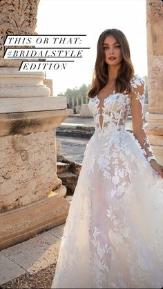 a woman in a white wedding dress standing next to a stone column with the caption's name on it