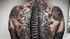 the back of a man with tattoos on his body