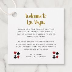 a white card with gold foil lettering on it that says, welcome to las vegas