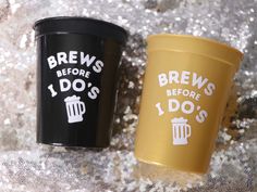 two coffee cups sitting next to each other on top of a glitter covered surface with the words brews before i do's and 1 do's