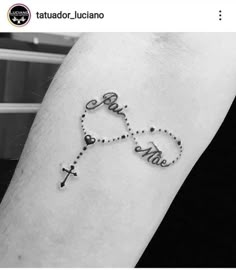 a tattoo with the word love and two crosses on it's arm that reads, faith