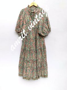 ITEM DESCRIPTION red green floral printed women's maxi dress - V neckline with frill collar summer long dress - 3/4th sleeves boho dress  Features: 3/4th sleeve, V neck, Long dress Fabric : 100% Cotton cambric hand block printed fabrics  Sleeve Length = 18 inch For more sizes & their measurement, please refer our below chart to understand the sizes variations available with us For your size requirement, please mention your size in seller note at the time of buying. SIZE MEASUREMENT  BUSTLENGTHSH Green Printed Maxi Floral Dress, Green Bohemian Midi Floral Dress, Green Half Sleeve Maxi Dress For Summer, Green Bohemian Maxi Floral Dress, Green Long Floral Print Dress, Long Green Floral Print Dresses, Green Bohemian Floral Maxi Dress, Green 3/4 Sleeve Summer Midi Dress, Green Boho Print Maxi Dress For Spring