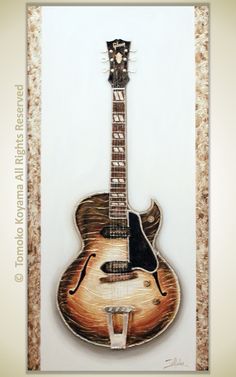 a painting of an acoustic guitar hanging on the wall in front of a white background