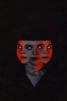 an image of two people in the dark with red light coming from their eyes and head