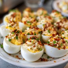 several deviled eggs are arranged on a plate