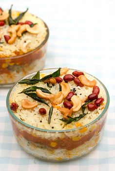 two bowls filled with rice and nuts on top of a checkered tablecloth covered table