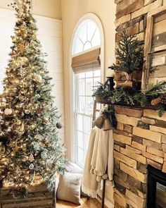 This rustic living room features a pine tree and garland on the dark wood mantel of a stone fireplace. A tree with gold Christmas tree decorations stands in front of an off-white wall with tall white shiplap wainscoting. A rustic wood box is placed on the warm wood floor...   Image: ourrustichaven Happy New Week, Friends Happy, New Week, Happy Monday, Happy New, Christmas Tree, Holiday Decor, Christmas, On Instagram