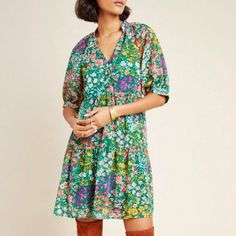 This Maeve Melinda Tunic Shirt Dress Is Brand New, Never Worn With Tags. With An Eye-Catching Floral Print, This Tiered Tunic Radiates Effortless Style - Pair It With White Sneakers To Dress Down Or Your Favorite Heels To Dress Up. This Is A Light Weight, Boho, Flowy Style With Specific Dimensions In The Photographs. * Polyester; Rayon Lining (Fully Lined Body) * Henley-Style Three Bronze Button Front * Short Sleeves (Sheer) * Tiered Tunic Silhouette * Pullover Styling * Machine Wash Cold. * She Green Floral Print Shift Mini Dress, Purple Floral Print Knee-length Mini Dress, Feminine Multicolor Mini Dress For Daywear, Multicolor Floral Print Mini Dress For Daywear, Purple Short Sleeve Dress For Fall, Short Sleeve Purple Fall Dress, Short Sleeve Purple Dress For Fall, Floral Print Shift Mini Dress For Spring, Green Shift Dress For Daywear