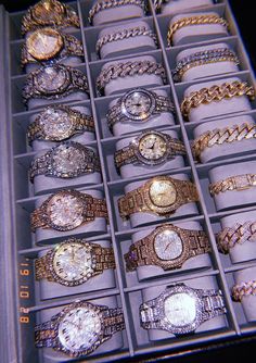 a box filled with lots of different types of watches