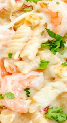 pasta salad with shrimp and parsley on top