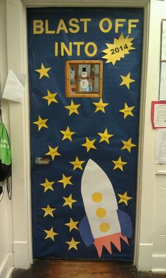 a door decorated with stars and a rocket ship in the center that says blast off into 2013