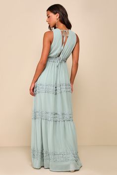 You'll know you made the right choice from the minute you slip into the Lulus Adoring Effect Sage Brush Chiffon Tiered Ruffled Maxi Dress! Lightweight woven chiffon shapes a sleeveless bodice with a plunging V-neckline and V-back (with a slender tie), gathered cups, and an elasticized, ruffled waist. Skirt falls into a flaring silhouette, with cascading tiers and bands of darling ruffled trim, ending at a maxi hem. Fit: This garment fits true to size. Length: Floor length. Size medium measures 6 Flowy Tiered Maxi Dress For Date Night, Spring Chiffon Maxi Dress With Lace Trim, Beach Chiffon Dress With Lace Trim, Chic Tiered Maxi Dress With Lace Trim, Beach Chiffon Maxi Dress With Ruffle Hem, Chiffon Maxi Dress With Ruffle Hem For Beach, Chiffon Maxi Dress With Lace Trim, Casual Chiffon Maxi Dress With Smocked Back, Fitted Breezy Maxi Dress With Ruffles