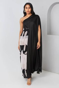 Black and beige one-shoulder maxi dress with abstract print on one side. - Aza Fashions One Shoulder Chiffon Maxi Dress, Evening One-shoulder Maxi Dress With Draped Sleeves, One Shoulder Chiffon Evening Midi Dress, One-shoulder Maxi Dress With Side Slits, Black One-shoulder Dress With Side Slits, One Shoulder Black Dress With Side Slits, Chic Black One Shoulder Dress With Side Slits, Asymmetrical One Shoulder Dress With Draped Sleeves For Summer, Chiffon One-shoulder Maxi Dress For Evening