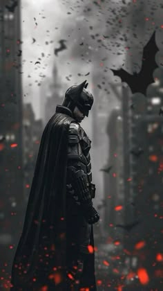 a batman standing in the rain with bats flying around