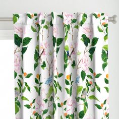 a white curtain with pink flowers and green leaves