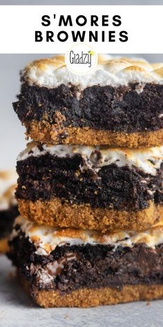 three brownies stacked on top of each other with white frosting and chocolate chips