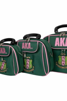 three green and pink luggage bags with the letters aka written on each one side