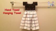 a dress hanging on a towel rack with the words hand towel hanging towel above it