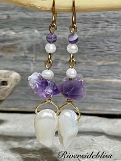 These are such a beautiful color of purple! Genuine raw Amethyst stone beads and small chevron amethyst beads .... small freshwater cultured Pearls and genuine Baroque pearls at the bottom! Gold non-tarnishing wire. The ear wires are 10K gold plated!  Personally Handmade! please check measurements , it can be difficult to determine the exact size from the photos!  MEASUREMENTS :  Earrings: 2 1/2" long including ear wires  Purple chevron amethyst beads: 6mm Small pearls: 7mm  Amethyst raw chunks: Single Purple Drop Earring, Purple Single Drop Earring, Purple Teardrop Pearl Drop Earrings, Purple Pearl Earrings For Pierced Ears As A Gift, Purple Pearl Earrings As Gift, Purple Pearl Earrings Gift, Purple Pearl Earrings For Gift, Handmade Purple Dangle Pearl Earrings, Purple Dangle Earrings With Ear Wire