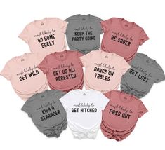 nine t - shirts with different sayings on them in pink, grey and white