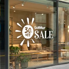 a store window with the words summer sale written on it