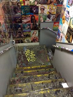 the stairs are covered with graffiti and stickers