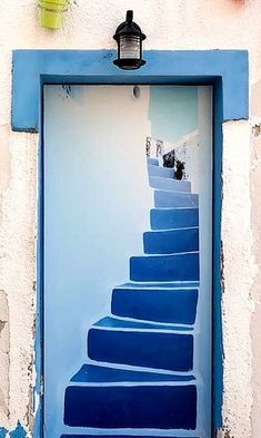 a blue door with stairs painted on it