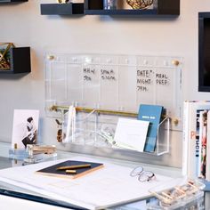 a desk with some books and glasses on it