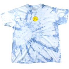 a tie dye shirt with a smiley face on it