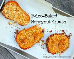 three baked honeynut squash sitting on top of a piece of parchment paper with the words twice - baked honeynut squash