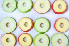 several apples are arranged in rows on a towel