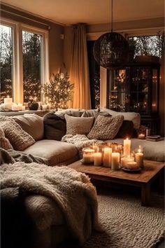 a living room filled with lots of furniture and candles