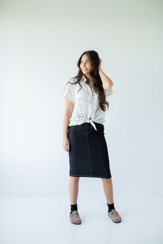 With the look of real denim but the feel of a quality knit, comfort is the key element in our exclusively designed 'Piper 'Skirt. The quick, pull on style with a fabric covered waistband makes this skirt a practical everyday option! Soft, comfortable knit denim fabric Functional Back Pockets 70% Rayon 25% Polyester 5% Spandex Wash Cold Gentle Cycle Hang to Dry Fabric covered elastic waistband Model A Height in Dark Blue 5'5" | Wearing Size Small Wearing 'Finch' Smocked Yoke Cotton Gingham Top in Casual Stretch Dark Wash Skirt, Casual Dark Wash Midi Denim Skirt, Casual Dark Wash Skirt For Fall, Casual Dark Wash Skirt For Everyday, Casual Dark Wash Lined Skirt, Relaxed Casual Denim Skirt For Fall, Casual Dark Wash Lined Denim Skirt, Casual Relaxed Denim Skirt For Fall, Casual Dark Wash Denim Skirt For Work