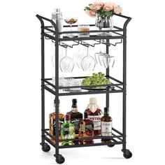 a bar cart with wine glasses and liquor bottles on it's wheels, holding drinks