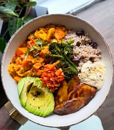 a white bowl filled with different types of food