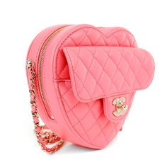 This Chanel Pink Lambskin Mini Heart Bag is in pristine un condition form the 2022 collection. Heart shaped pink lambskin mini bag is quilted in signature Chanel diamond pattern. Front flap pocket with gold interlocking CC twist lock. Top zipper closure with fabric interior. Long leather and chain entwined strap may be comfortably carried across the body. Dust bag included. Measurements: 5.25” x 4.5” x 1.75” drop: 22” Proudly offered from Only s for $10,900.00. Payment by bank wire only. Please email for additional photos of this item. PBF 13224 Chanel 2022, Chanel Pink, Fasion Outfits, Ysl Shoes, Jimmy Choo Sunglasses, Pink Chanel, Heart Bag, Trending Handbag, Mini Heart