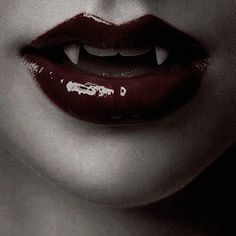 a woman's mouth with red lipstick on it and the word marilyn monroe written in white