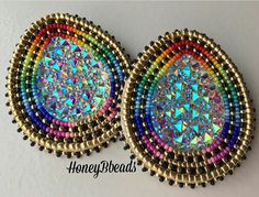 pair of multicolored beaded earrings on white background with honeybeads logo